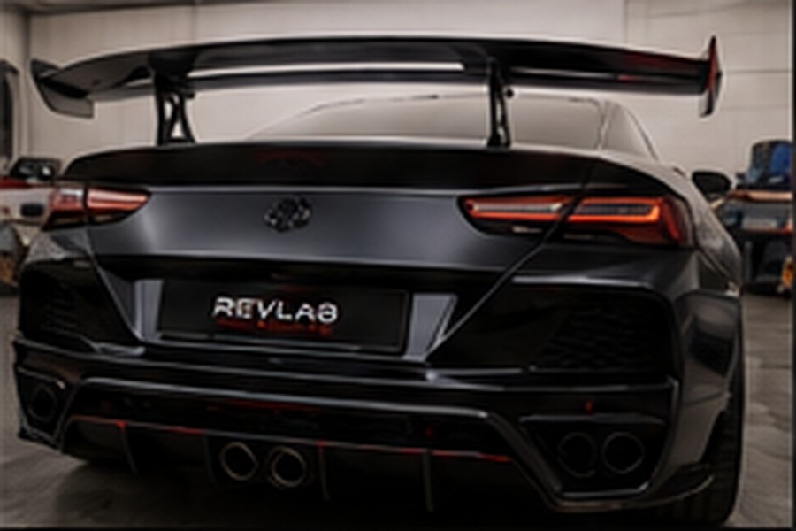Modified vehicle rear with an upgraded body kit and spoiler